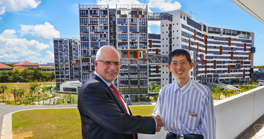 Professor Yeo Kiat Seng, SUTD's Associate Provost for Graduate Studies and International Relations, and Silvaco's CEO David L. Dutton cement the RF IC design collaboration. 