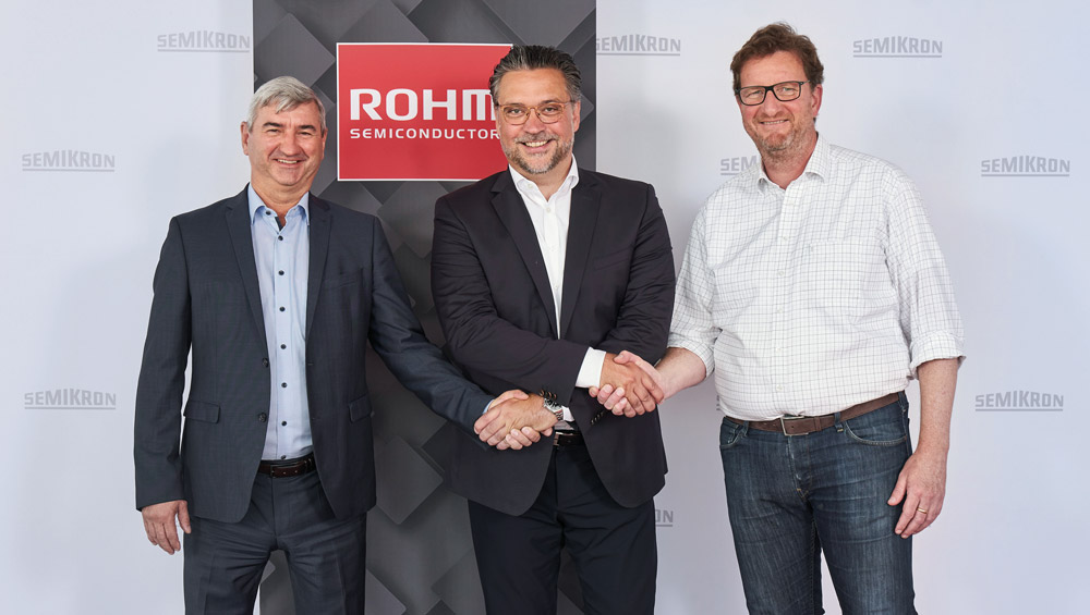 SEMIKRON’s CEO & CTO Karl-Heinz Gaubatz (left), and CSO Peter Sontheimer (right), with ROHM Semiconductor GmbH’s president Wolfram Harnack (center).