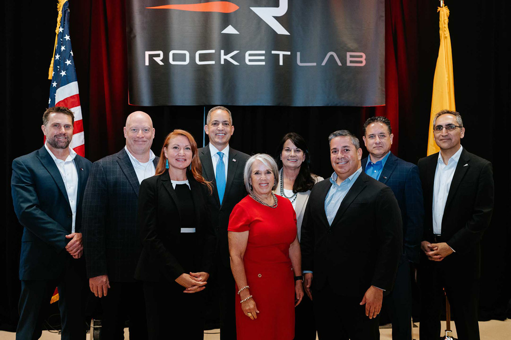Pictured (left to right): Rocket Lab’s VP operations Jerry Winton and chief financial officer Adam Spice; US Congresswoman Melanie Stansbury; Deputy Secretary of Commerce Don Graves; New Mexico Governor Michelle Lujan Grisham; Albuquerque City Councilor Renee Grout; US Senator Ben Ray Luján; Dr Brad Clevenger, VP & general manager of Rocket Lab Space Systems; and Navid Fatemi, VP business development Rocket Lab. (Image courtesy of Tiffani Cornish Photo.) 